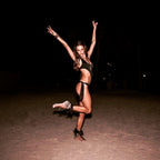 Alessandra Ambrosio dancing on the beach at night