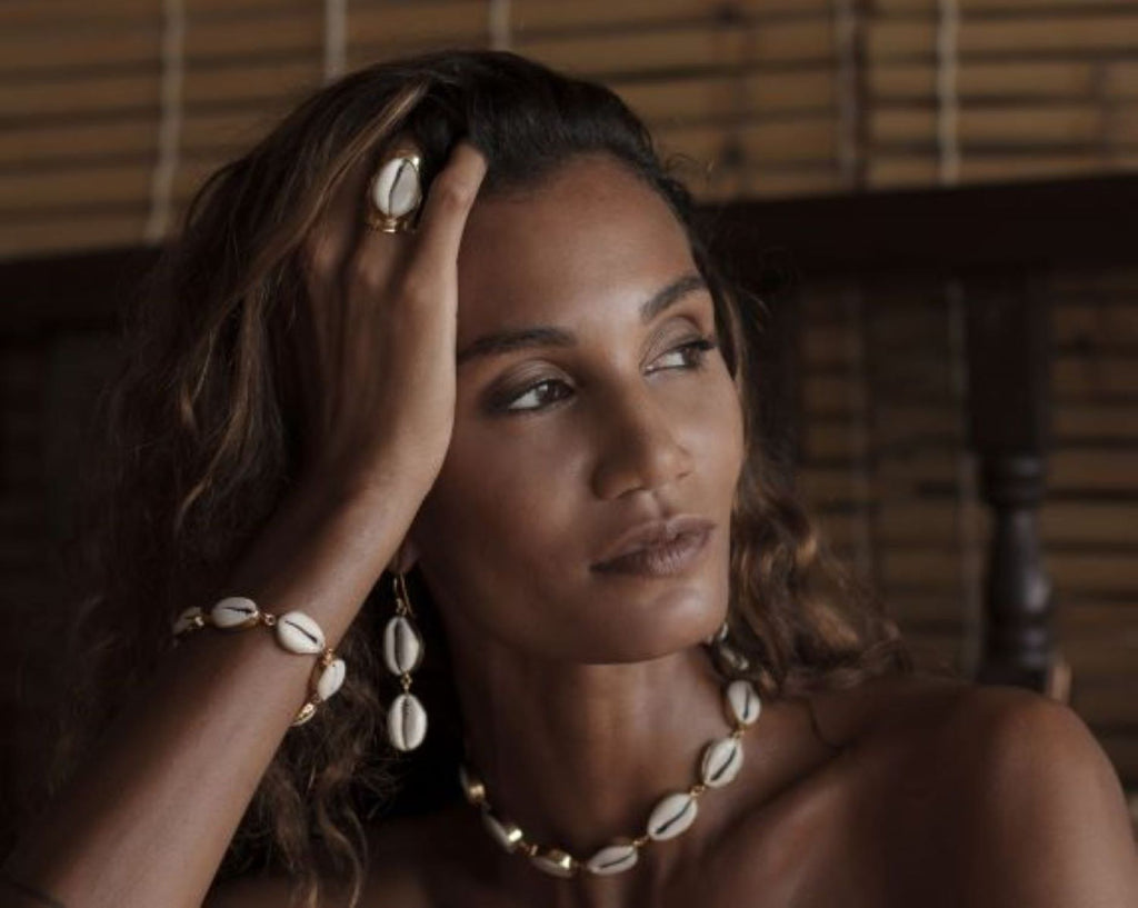 Woman wearing shell jewelry in a natural decor in Bali